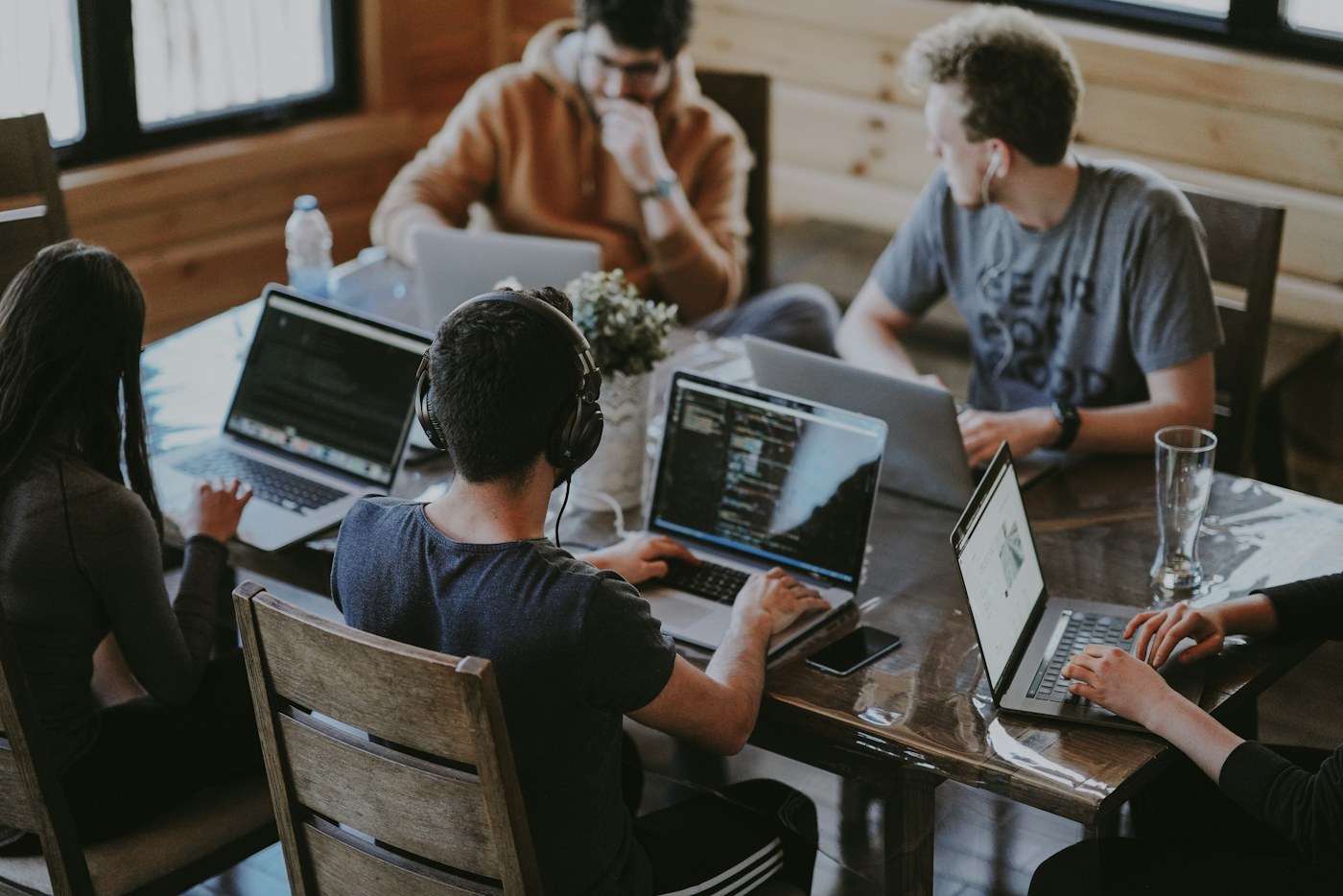 Colleagues working together on digital projects in a team workspace